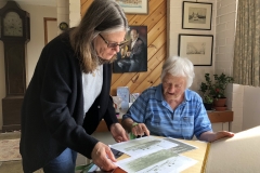 Deborah and Sonia go through Sonia's scrapbooks.