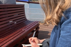 Taking notes on the ferry on the Mersey River.